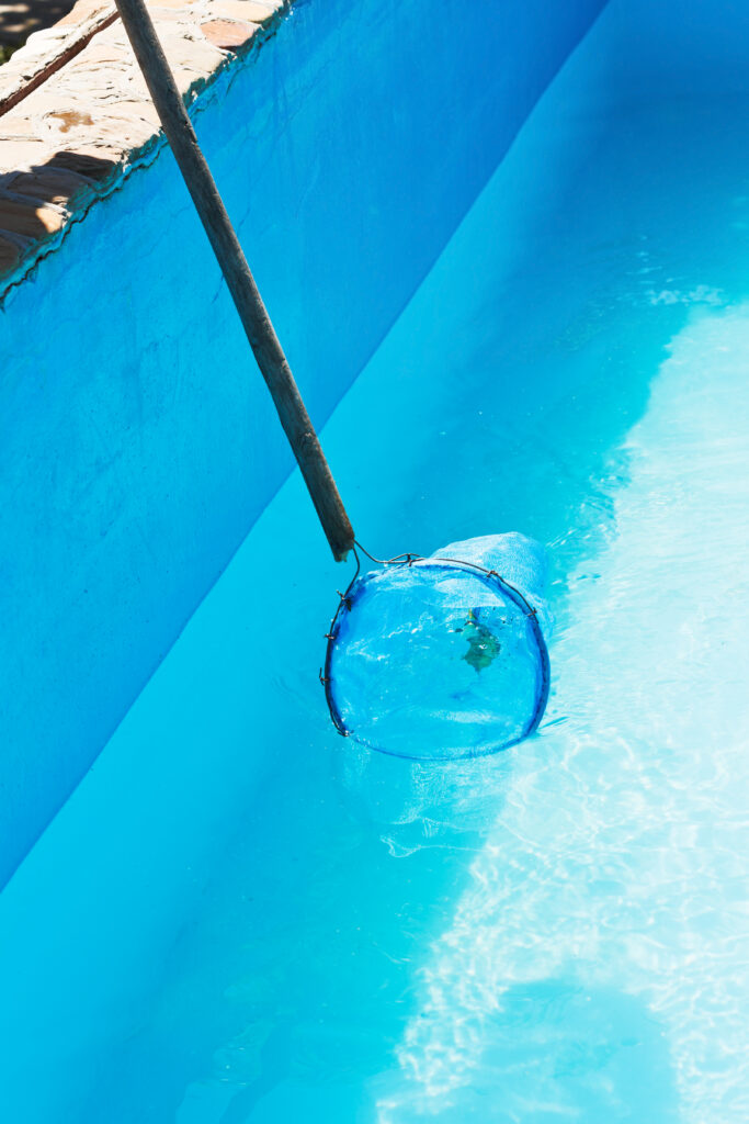 cleaning of garden outdoor swimming pool